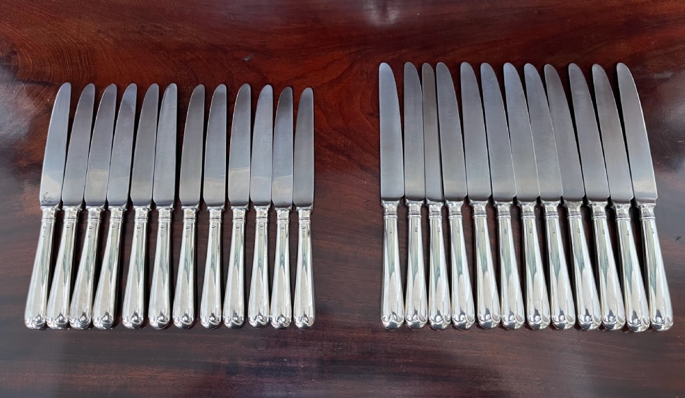 24 silver handled knives